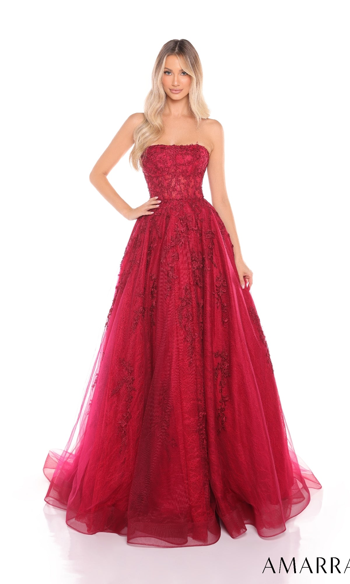 A woman models the Amarra 88414 long prom dress, featuring a strapless bodice, floral-lace embroidery, and a floor-length A-line tulle skirt, against a white background.